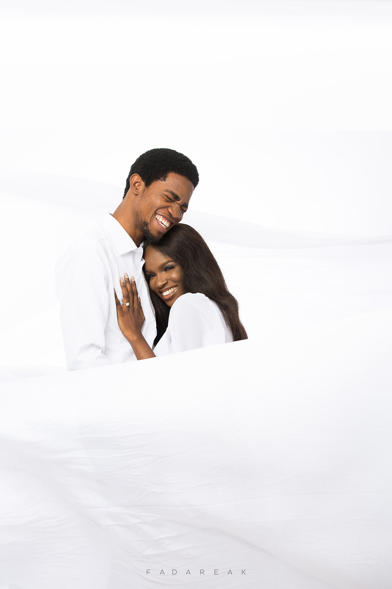 Couple embracing in soft white light