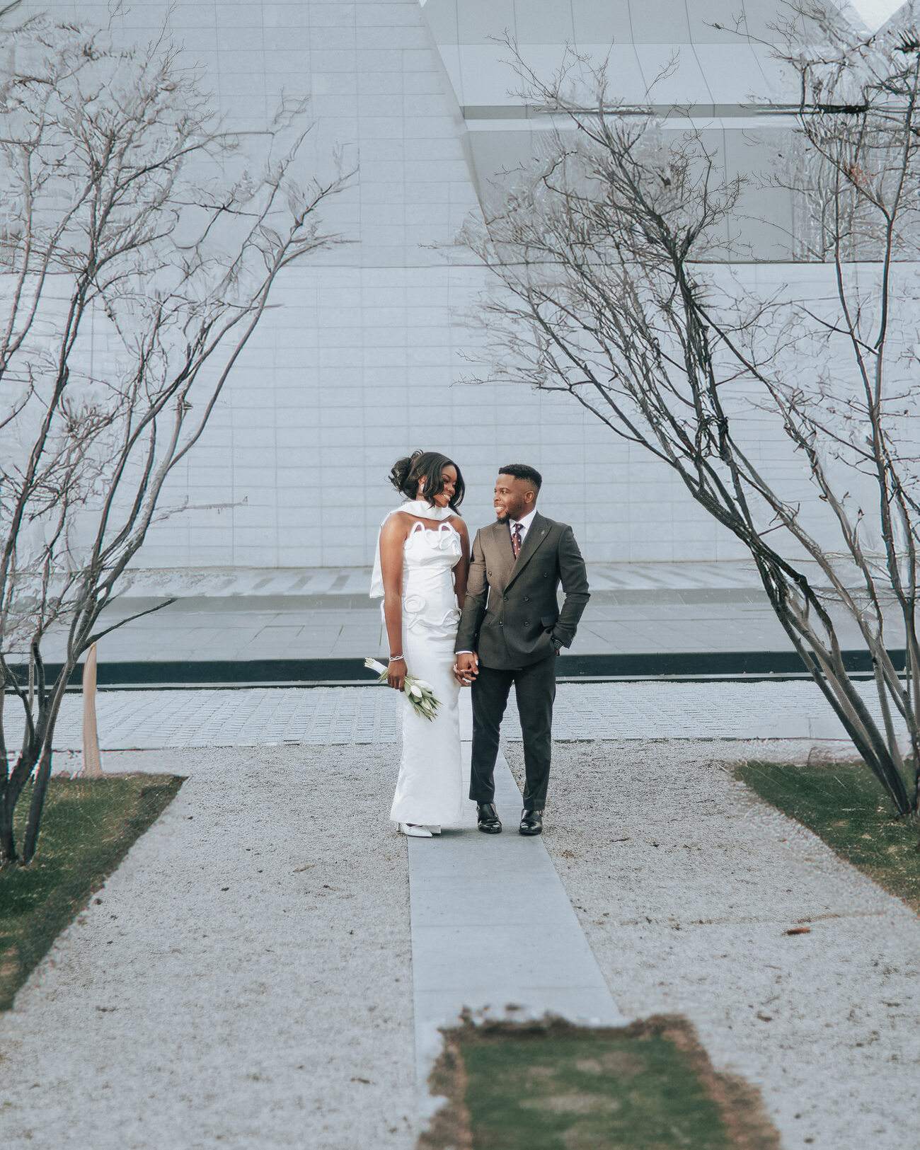 Couple on a tree-lined path